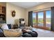 Living room featuring comfortable seating, french doors to mountain views, and stylish decor at 280 Hess Ave, Golden, CO 80401