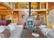 Cozy living room with fireplace and wood beam accents, offering a warm and inviting atmosphere at 280 Hess Ave, Golden, CO 80401