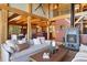 Spacious living room with a fireplace and views into the dining room and kitchen area at 280 Hess Ave, Golden, CO 80401