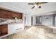 Bright kitchen featuring dark wood cabinets and open layout to the living area at 93 S Nome St, Aurora, CO 80012