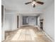 Open-concept living space featuring a fireplace and a seamless transition to other areas at 93 S Nome St, Aurora, CO 80012