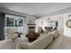 Cozy living room with fireplace, comfortable seating, and a dining area at 93 S Nome St, Aurora, CO 80012