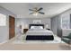 Cozy bedroom features a comfortable queen size bed, plush rug, and stylish gray walls at 93 S Nome St, Aurora, CO 80012