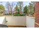 Patio area surrounded by lush greenery and trees at 93 S Nome St, Aurora, CO 80012