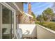 Balcony with sliding glass doors overlooking the yard at 93 S Nome St, Aurora, CO 80012