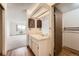 Bright bathroom with white vanity and mirrored wall that lets in natural light at 14152 E Linvale Pl # 509, Aurora, CO 80014