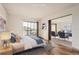 Bedroom featuring modern design, wood floors, and an attached sitting area at 14152 E Linvale Pl # 509, Aurora, CO 80014