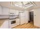 Bright kitchen featuring white cabinets, wooden floor and walk-in pantry at 14152 E Linvale Pl # 509, Aurora, CO 80014