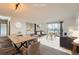 Bright living room showcasing modern decor, dining space, and an inviting balcony with scenic views at 14152 E Linvale Pl # 509, Aurora, CO 80014