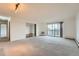 Bright living room featuring a sliding door to the balcony area, and natural light at 14152 E Linvale Pl # 509, Aurora, CO 80014