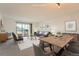 Bright living room showcasing stylish furniture, dining space, and an inviting balcony with scenic views at 14152 E Linvale Pl # 509, Aurora, CO 80014