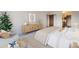 Bright main bedroom featuring stylish furniture, neutral colors, and an open floor plan into the closet at 14152 E Linvale Pl # 509, Aurora, CO 80014