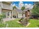 Backyard featuring playground, outdoor patio, and lush green grass at 3212 Fulton St, Denver, CO 80238