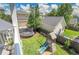 Spacious backyard featuring a playground, trampoline and lush green grass for outdoor fun and activities at 3212 Fulton St, Denver, CO 80238