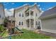 Large backyard with playground, deck, and beautiful landscaping at 3212 Fulton St, Denver, CO 80238