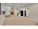 Spacious basement featuring a cozy stone fireplace and a staircase to upper floors at 3212 Fulton St, Denver, CO 80238
