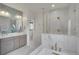 Bathroom with a freestanding tub, frameless shower, double vanity sinks, and stylish decor at 3212 Fulton St, Denver, CO 80238