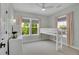 Bright bedroom with a lofted bed, featuring large windows for natural light and a cozy atmosphere at 3212 Fulton St, Denver, CO 80238
