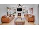 Comfortable living room with fireplace, hardwood floors, neutral rug, ample seating, and great natural light at 3212 Fulton St, Denver, CO 80238