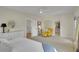 Spacious main bedroom with walk-in closet, large windows, sitting area, and neutral decor at 3212 Fulton St, Denver, CO 80238