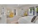 Spacious main bedroom with walk-out balcony, large windows, sitting area, and ensuite bathroom at 3212 Fulton St, Denver, CO 80238