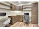 Well-appointed home office with custom cabinetry, stylish desks, and ample storage space at 3212 Fulton St, Denver, CO 80238