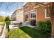Private backyard with a concrete patio, built-in grill area, and green lawn at 3567 E 140Th Dr, Thornton, CO 80602