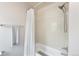 Bright bathroom featuring a shower with white subway tile, providing a clean and modern look at 3567 E 140Th Dr, Thornton, CO 80602