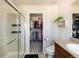 Bathroom with a glass-enclosed shower, walk-in closet, and stylish vanity at 3567 E 140Th Dr, Thornton, CO 80602