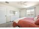 Comfortable bedroom features neutral walls, plush carpeting, and ample natural light at 3567 E 140Th Dr, Thornton, CO 80602