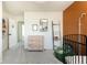 Stylish bedroom with a modern dresser, mirror, decorative ladder and a unique color accent wall at 3567 E 140Th Dr, Thornton, CO 80602