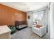 Bright Bedroom features a cozy crib, ample natural light, and plush carpeting at 3567 E 140Th Dr, Thornton, CO 80602