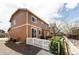 Two-story home featuring neutral brown siding and a white picket fence enclosing the gravel yard at 3567 E 140Th Dr, Thornton, CO 80602
