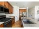 Well-equipped kitchen with granite counters, stainless appliances, and ample storage space at 3567 E 140Th Dr, Thornton, CO 80602