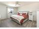 Serene main bedroom with a comfortable bed, plush carpet, and bright window at 3567 E 140Th Dr, Thornton, CO 80602