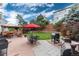 Spacious backyard with a patio, outdoor seating, a grill, and lush greenery for outdoor enjoyment at 10245 Nottingham Dr, Parker, CO 80134
