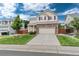 Charming two-story home with a brick facade, manicured lawn, and inviting curb appeal at 10245 Nottingham Dr, Parker, CO 80134