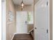Welcoming foyer with wood floors, coat hooks, and natural light at 10245 Nottingham Dr, Parker, CO 80134