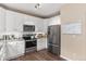 Modern kitchen with stainless steel appliances, white cabinets, and granite countertops at 10245 Nottingham Dr, Parker, CO 80134