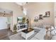 Inviting living room with a fireplace, television, and comfortable sectional sofa at 10245 Nottingham Dr, Parker, CO 80134