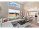 Open living space with hardwood floors and large windows at 10245 Nottingham Dr, Parker, CO 80134