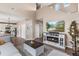 Living room with a fireplace, television, and hardwood floors at 10245 Nottingham Dr, Parker, CO 80134
