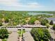Stunning aerial view of apartments surrounded by lush greenery and a serene lake at 1517 S Owens St # 5, Denver, CO 80232