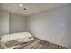This basement bedroom features wood-style flooring and neutral tones at 1517 S Owens St # 5, Denver, CO 80232