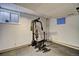 This basement workout room features space and access to a window at 1517 S Owens St # 5, Denver, CO 80232