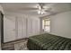 Bright bedroom features a ceiling fan, a closet, and a window, offering a functional and inviting space at 1517 S Owens St # 5, Denver, CO 80232