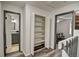Hallway with storage closet between the bathroom and bedroom at 1517 S Owens St # 5, Denver, CO 80232