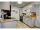 Efficient kitchen featuring granite countertops, tile backsplash, and modern appliances at 1517 S Owens St # 5, Denver, CO 80232