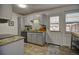 Updated kitchen with granite counters, backsplash, and a convenient back door at 1517 S Owens St # 5, Denver, CO 80232