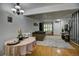 Cozy open-plan living and dining area with hardwood floors and abundant natural light at 1517 S Owens St # 5, Denver, CO 80232